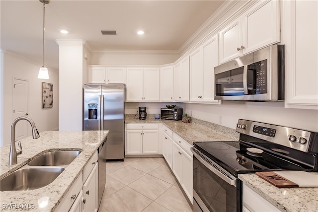 kitchen featuring appliances with stainless steel finishes, sink, decorative light fixtures, white cabinets, and ornamental molding