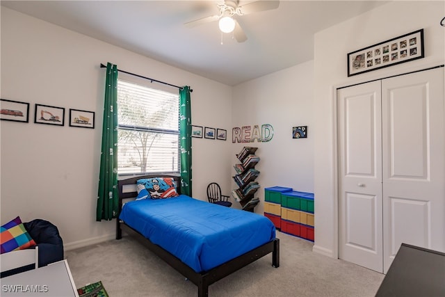 bedroom with light carpet, a closet, and ceiling fan