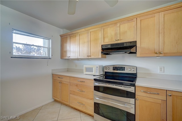 kitchen with stainless steel range with electric stovetop, light tile patterned floors, and light brown cabinetry