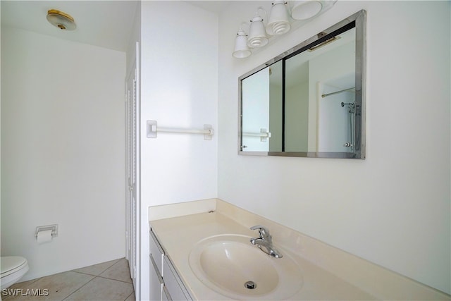 bathroom with tile patterned floors, vanity, and toilet