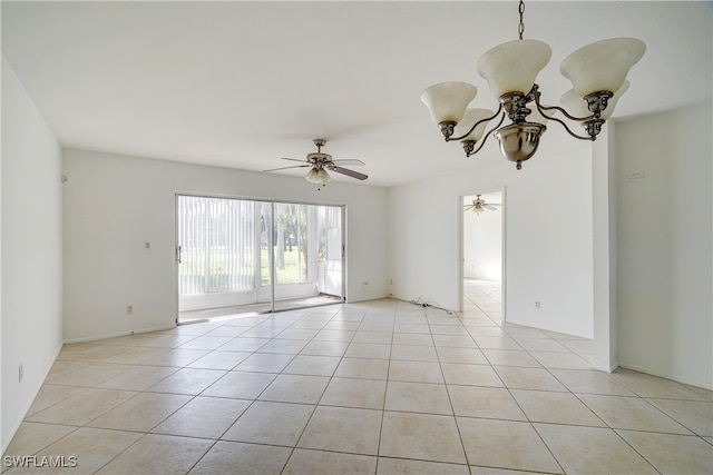 unfurnished room featuring light tile patterned flooring and ceiling fan with notable chandelier