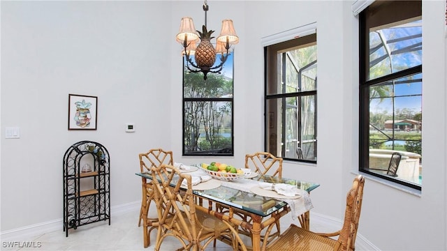 dining area featuring a notable chandelier