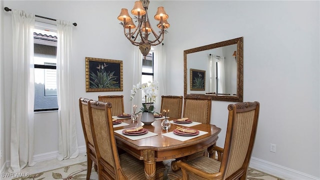 dining space with an inviting chandelier