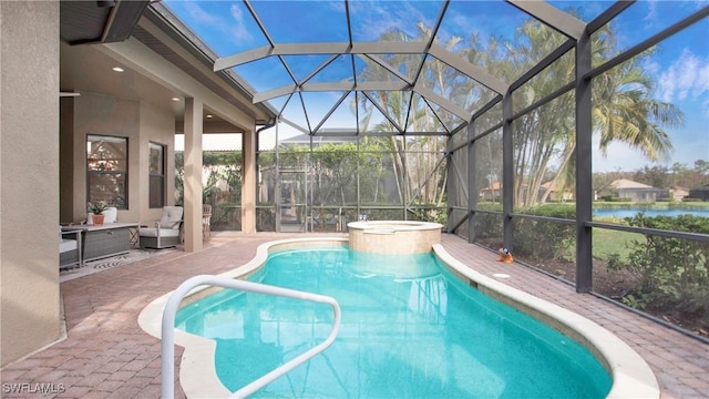 view of pool with glass enclosure, a water view, an outdoor hangout area, an in ground hot tub, and a patio