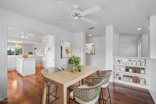 dining area featuring dark wood-type flooring