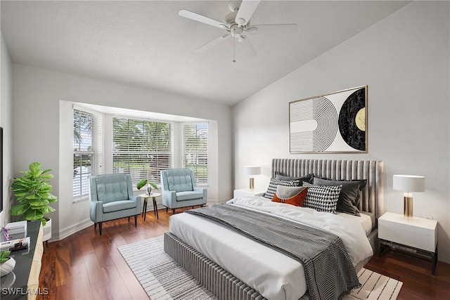 bedroom featuring dark wood-type flooring, ceiling fan, and lofted ceiling