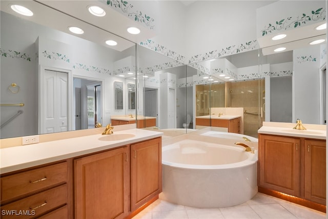 bathroom featuring vanity, independent shower and bath, and tile patterned flooring