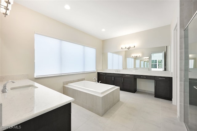 bathroom featuring vanity, plus walk in shower, and tile patterned flooring