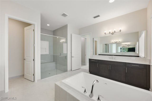 bathroom featuring vanity, separate shower and tub, and tile patterned floors