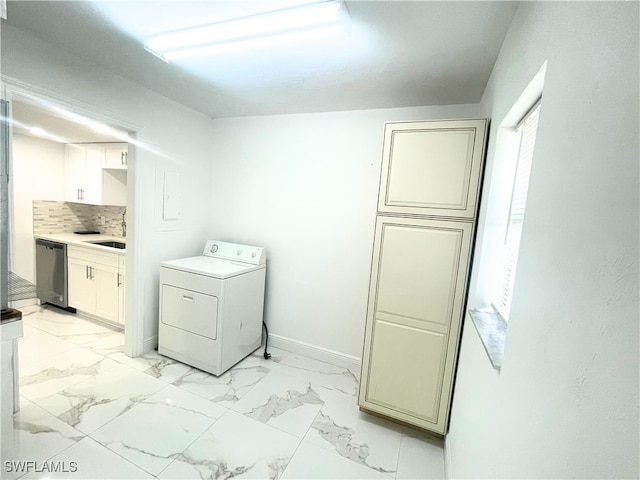 washroom featuring washer / clothes dryer and sink