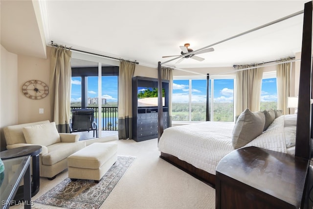 bedroom featuring ornamental molding, light colored carpet, access to outside, and ceiling fan