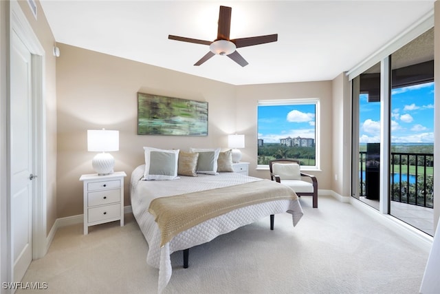 bedroom featuring ceiling fan, access to outside, and light colored carpet