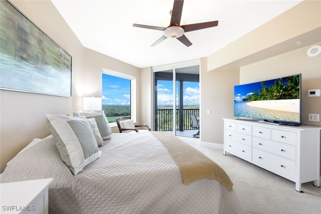 carpeted bedroom with ceiling fan and access to outside