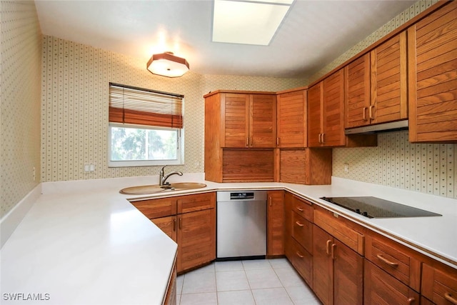 kitchen featuring sink, dishwasher, black electric stovetop, and light tile patterned flooring