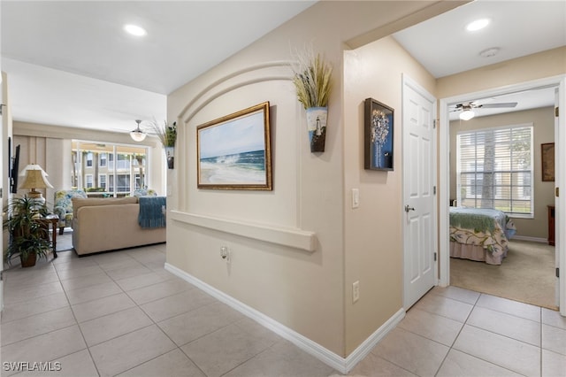 hallway with light tile patterned floors