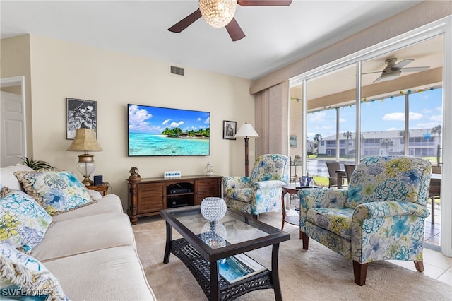 tiled living room featuring ceiling fan