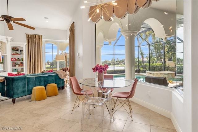 dining area featuring light tile patterned flooring, ceiling fan, and plenty of natural light