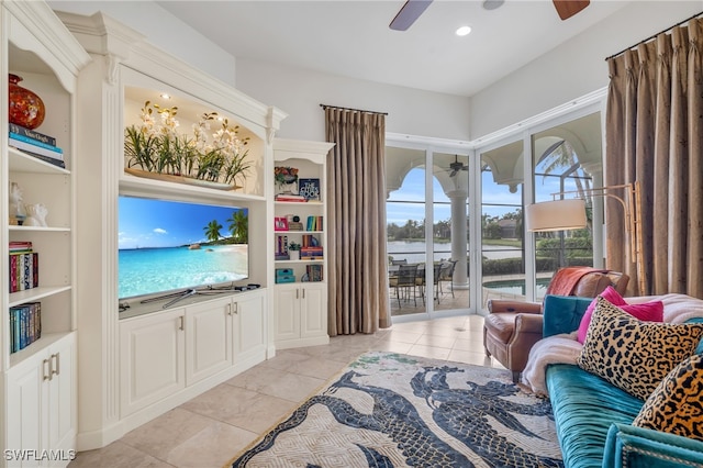 living room featuring ceiling fan and light tile patterned flooring