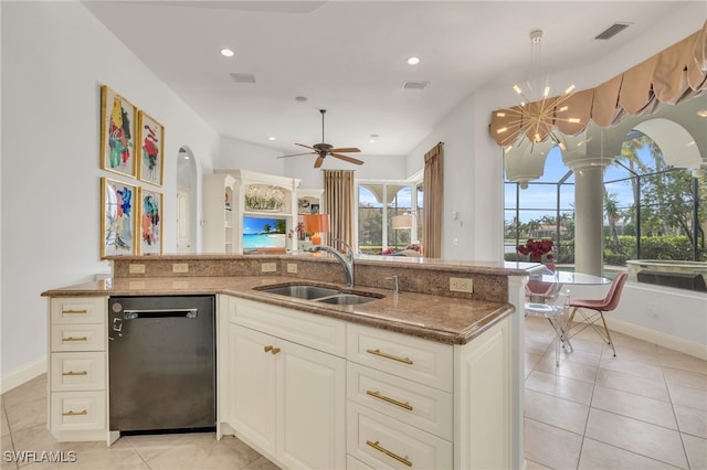 kitchen featuring sink, dishwasher, decorative light fixtures, and a healthy amount of sunlight