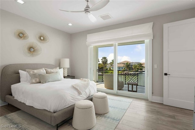 bedroom featuring hardwood / wood-style floors, access to outside, and ceiling fan