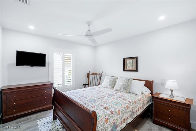 bedroom featuring ceiling fan and light hardwood / wood-style flooring