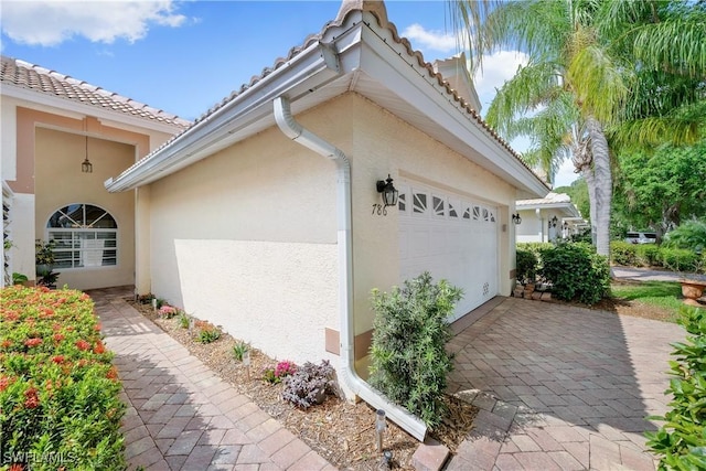 view of side of home with a garage