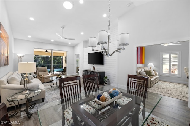 interior space featuring hardwood / wood-style floors, high vaulted ceiling, and ceiling fan