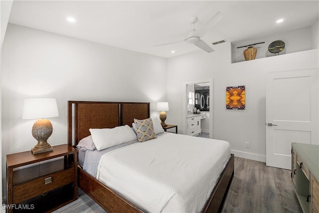 bedroom featuring ceiling fan, ensuite bathroom, and wood-type flooring