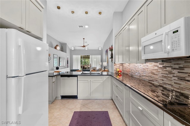 kitchen with white appliances, ceiling fan, light tile patterned floors, and kitchen peninsula