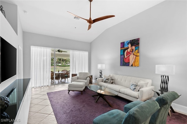 living room with ceiling fan, lofted ceiling, and light tile patterned floors