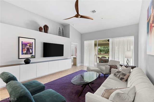 living room featuring light tile patterned flooring and vaulted ceiling