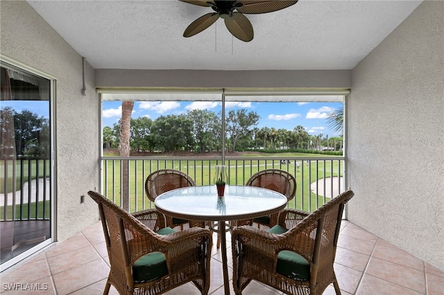 sunroom / solarium with ceiling fan