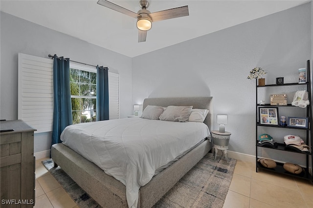 bedroom featuring light tile patterned flooring and ceiling fan