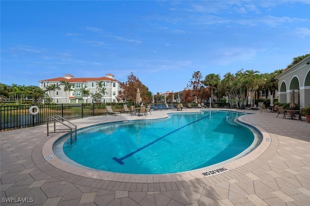 view of swimming pool with a patio area