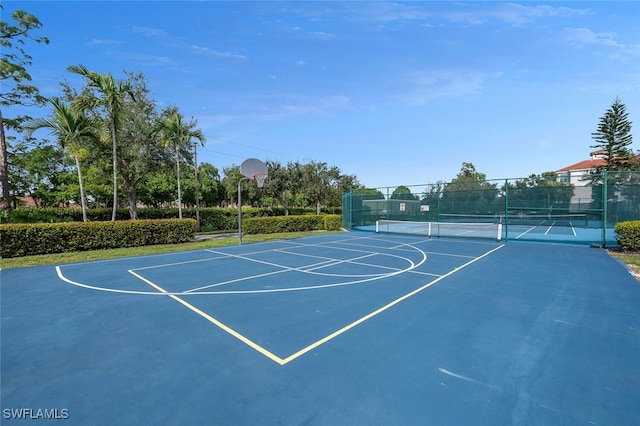 view of basketball court featuring tennis court