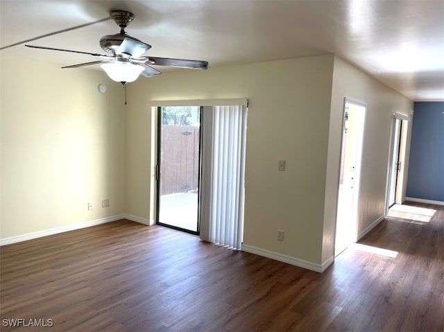 empty room featuring dark hardwood / wood-style floors and ceiling fan