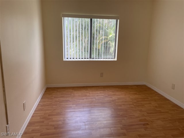 spare room with light wood-type flooring