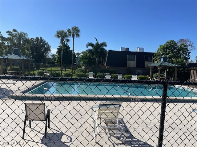 view of swimming pool featuring a gazebo