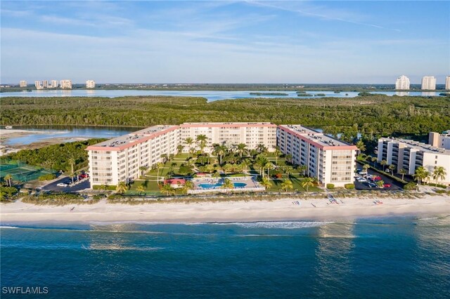 birds eye view of property featuring a view of the beach and a water view