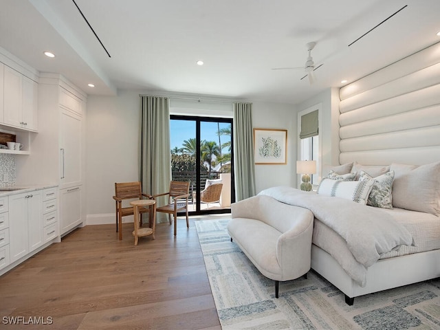 bedroom with access to outside, light hardwood / wood-style floors, and ceiling fan