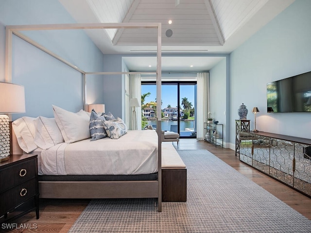 bedroom featuring hardwood / wood-style flooring and access to outside