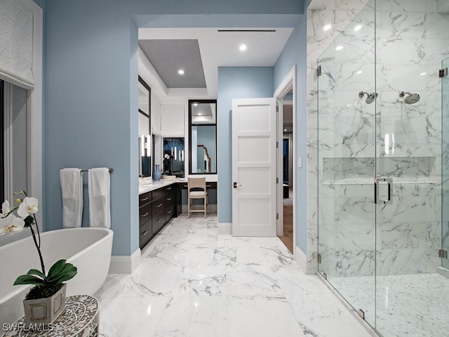 bathroom featuring vanity and shower with separate bathtub