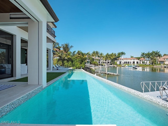 view of pool with a water view