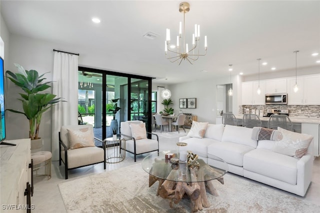 tiled living room featuring a notable chandelier