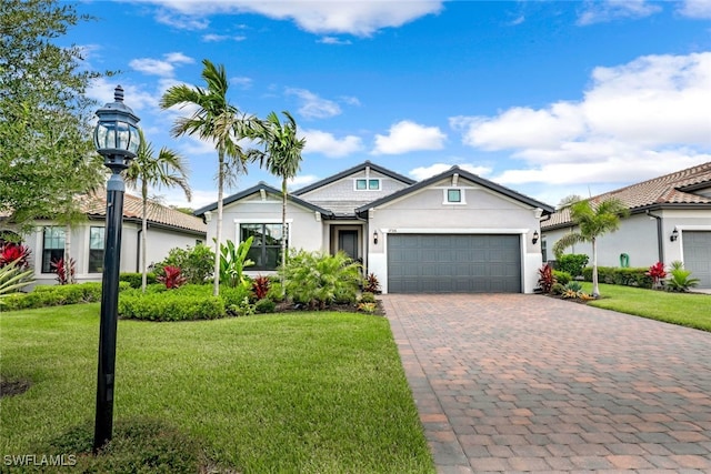 view of front facade with a front yard and a garage