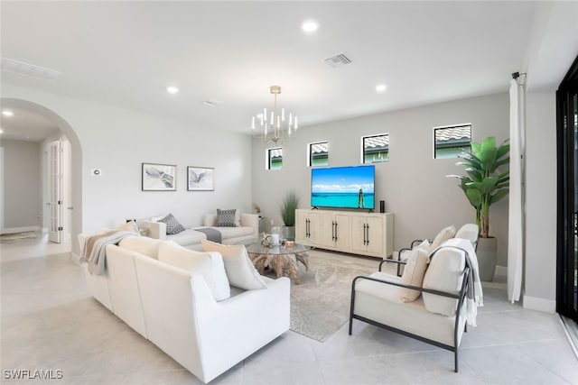 living room with a healthy amount of sunlight and a notable chandelier