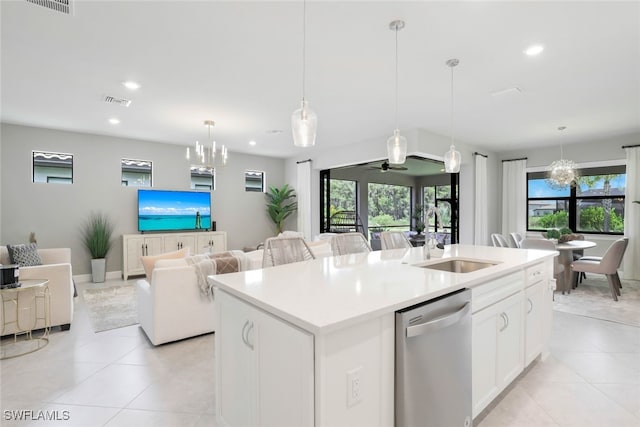 kitchen featuring sink, stainless steel dishwasher, pendant lighting, a kitchen island with sink, and ceiling fan with notable chandelier