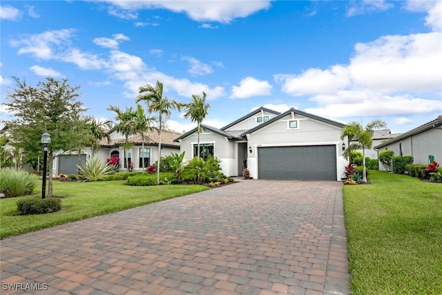 view of front of house with a garage and a front lawn