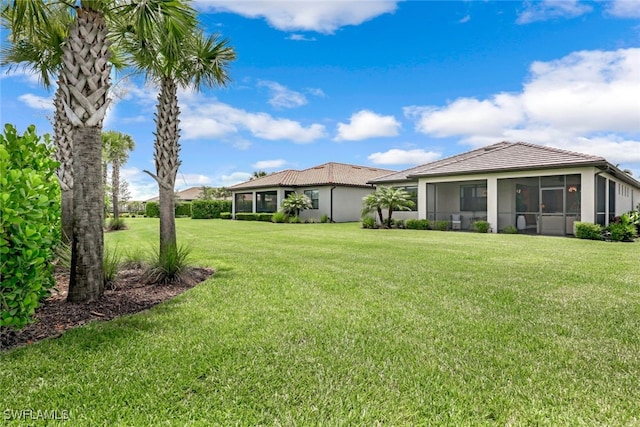 view of yard featuring a sunroom