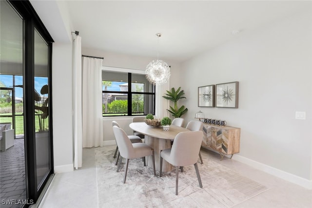 dining space with a notable chandelier